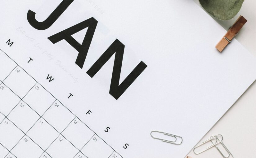 calendar of January on desk with paperclips